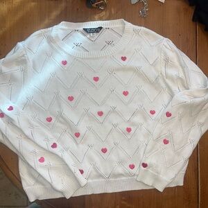 White sweater with pink hearts